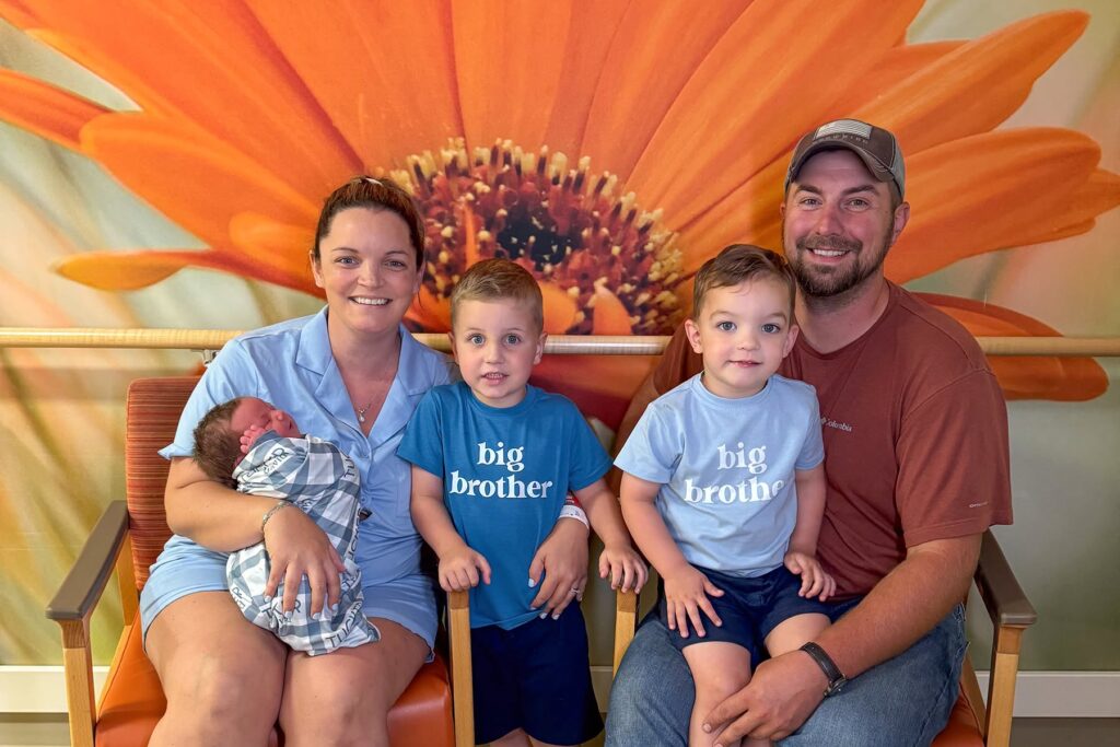 Family holding baby at Margaret Mary Health